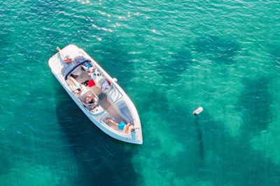 people on white boat