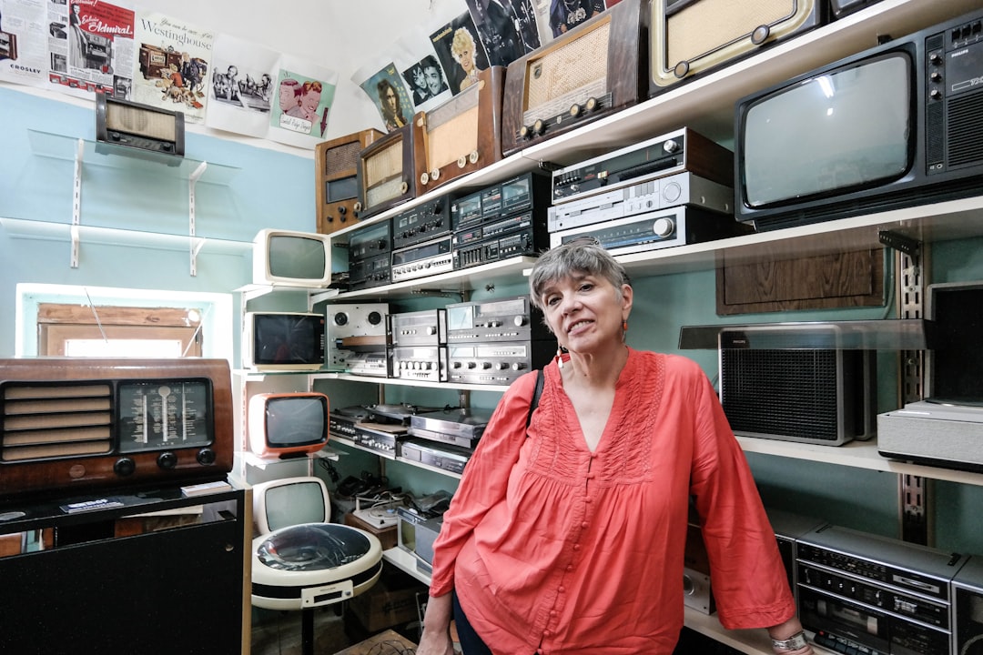 woman standing in front of television on display