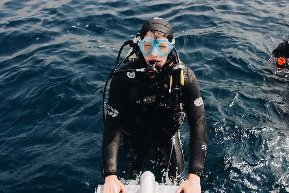 man wearing scuba diving suit