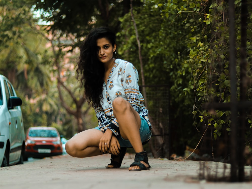 woman on road near cars