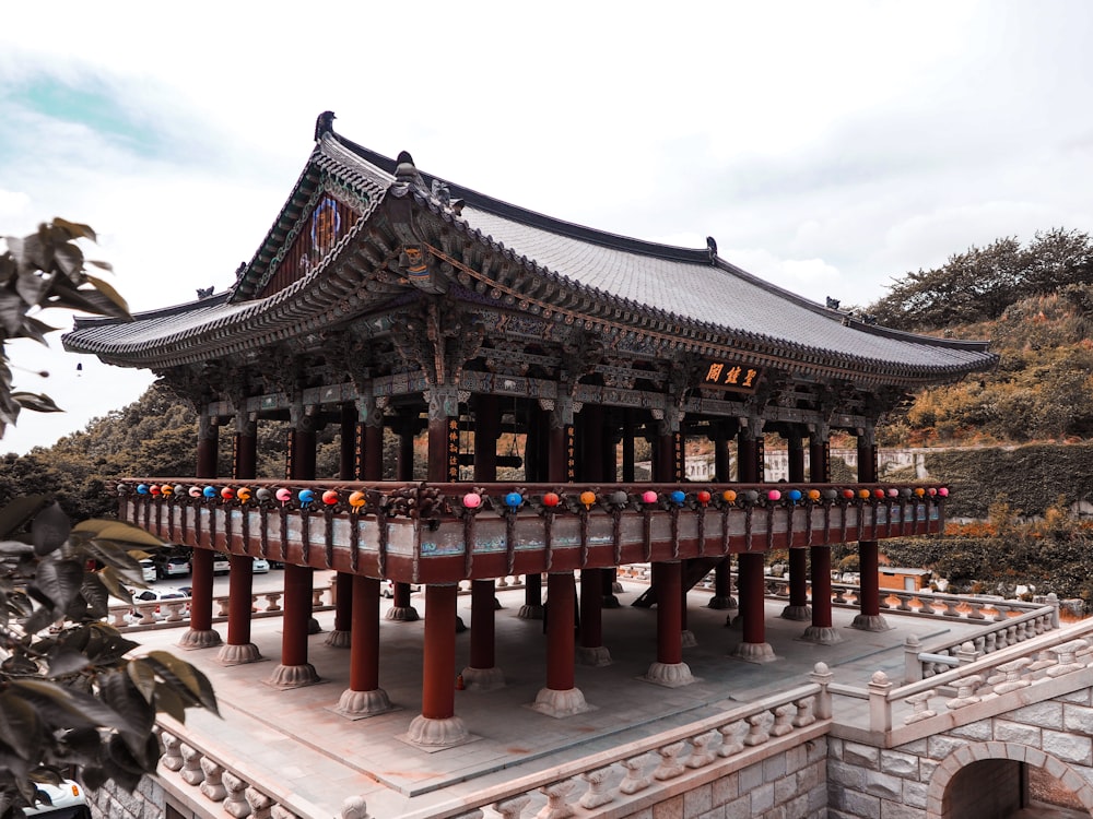 grey and red temple by the hill