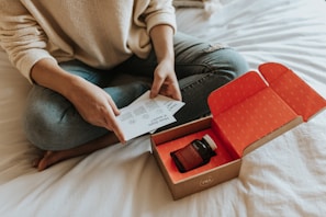 red-labeled amber glass tub on a box