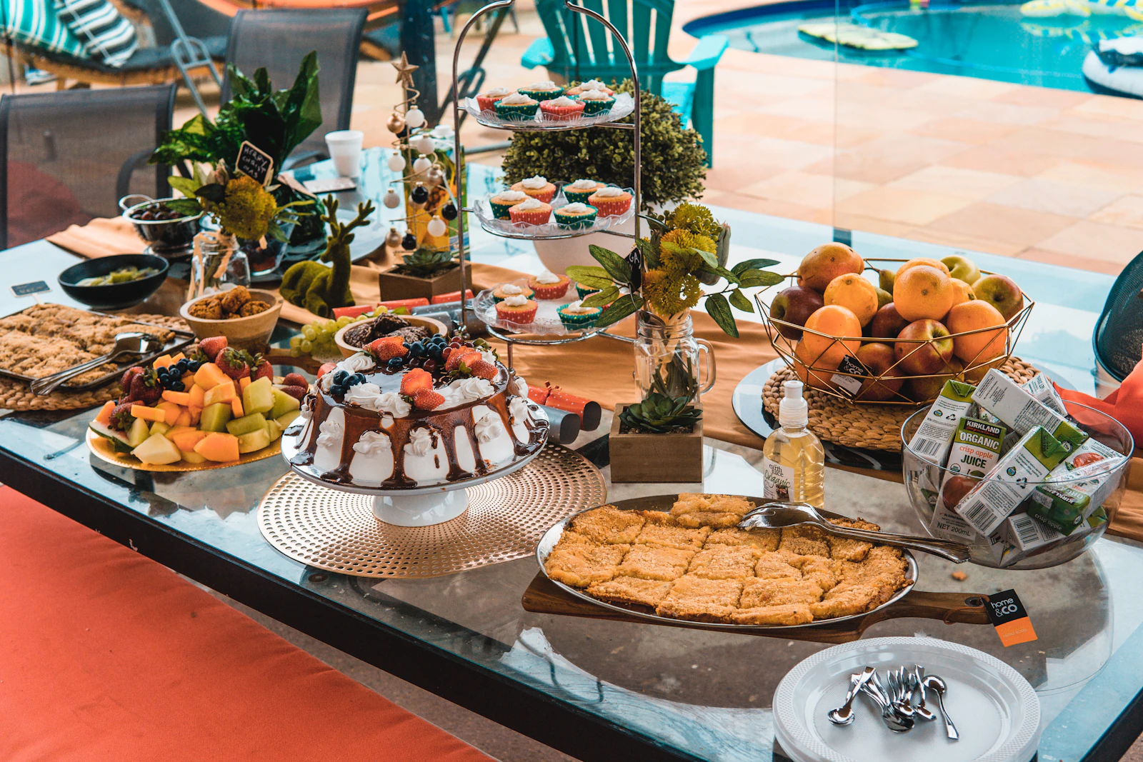 A table spread with an assortment of tarts, cakes, and pastries.
