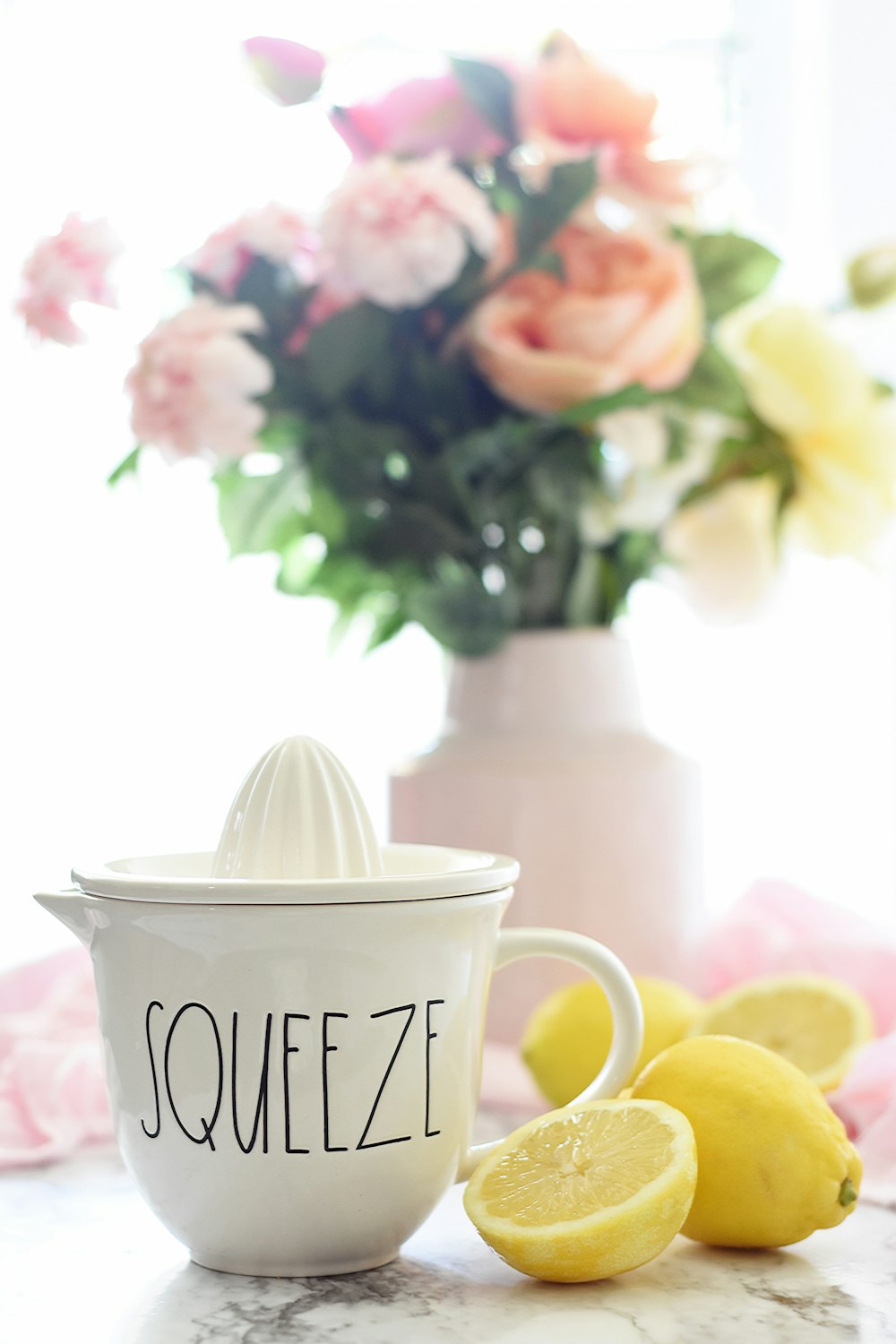 lemon beside white mug