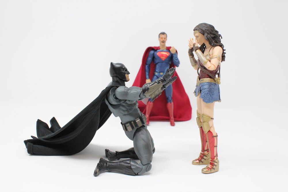 Superman, Batman, and Wonder Woman action figures