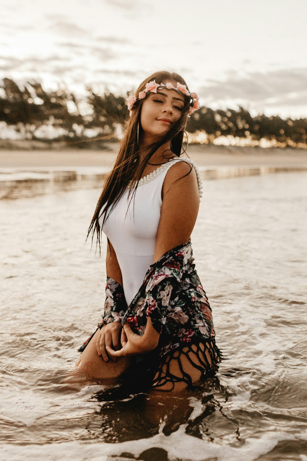 woman standing on body of water