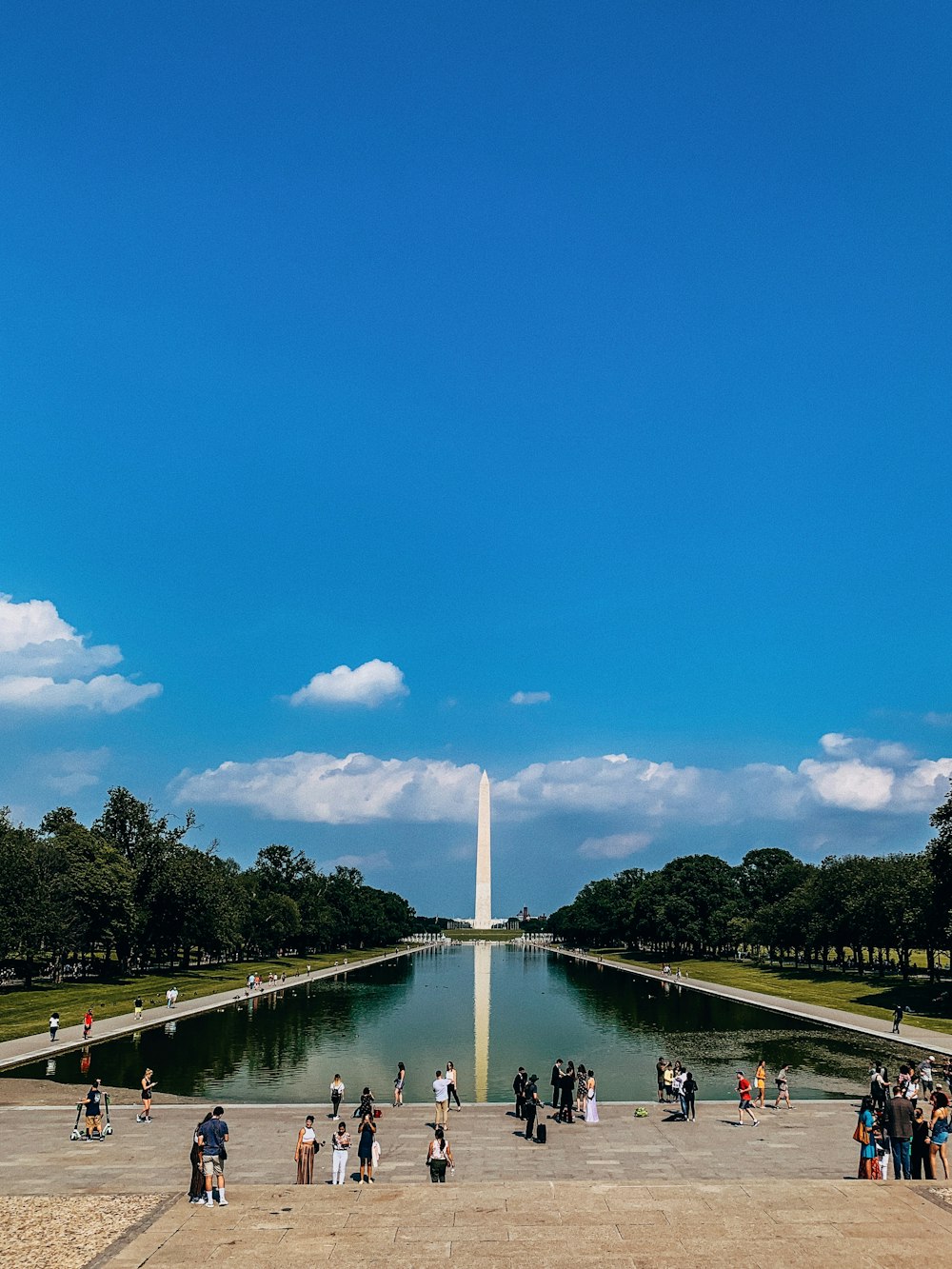 people standing near body of water