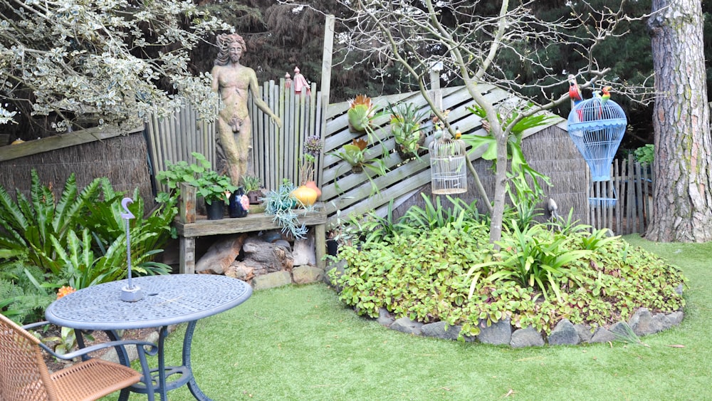 figurine on bench near bird cage