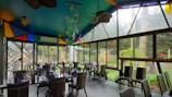 A vibrant dining area with a picturesque outdoor setting.