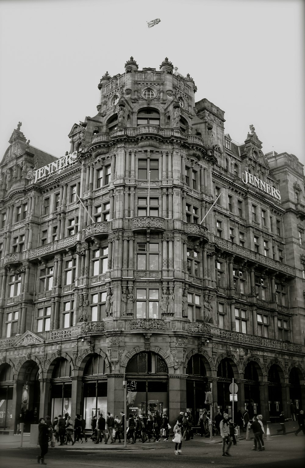 people walking and standing beside building