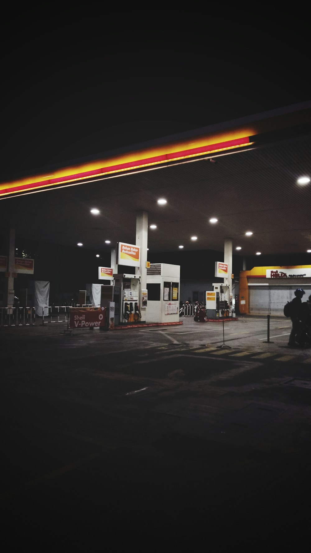 white gasoline station at night