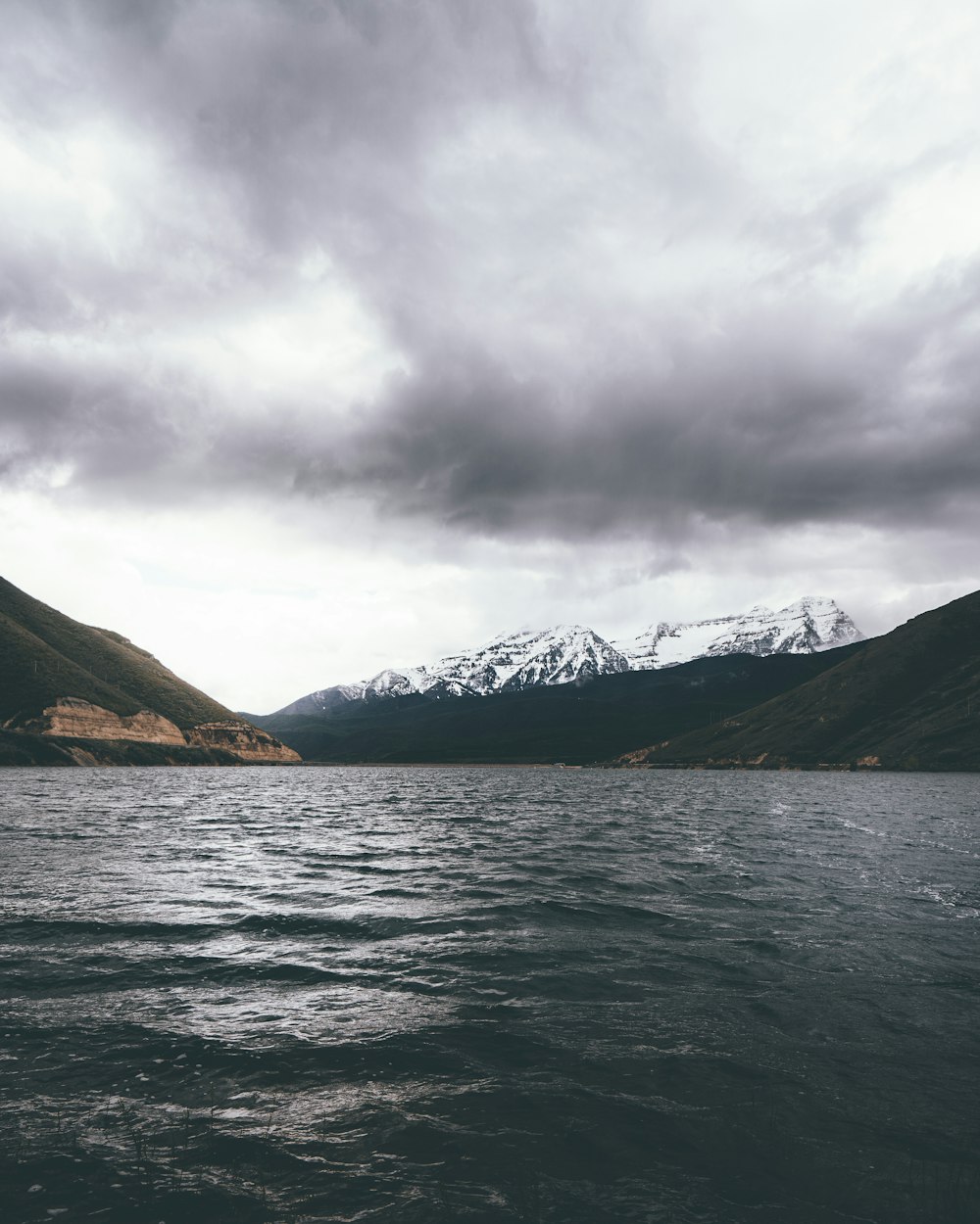 body of water near mountains