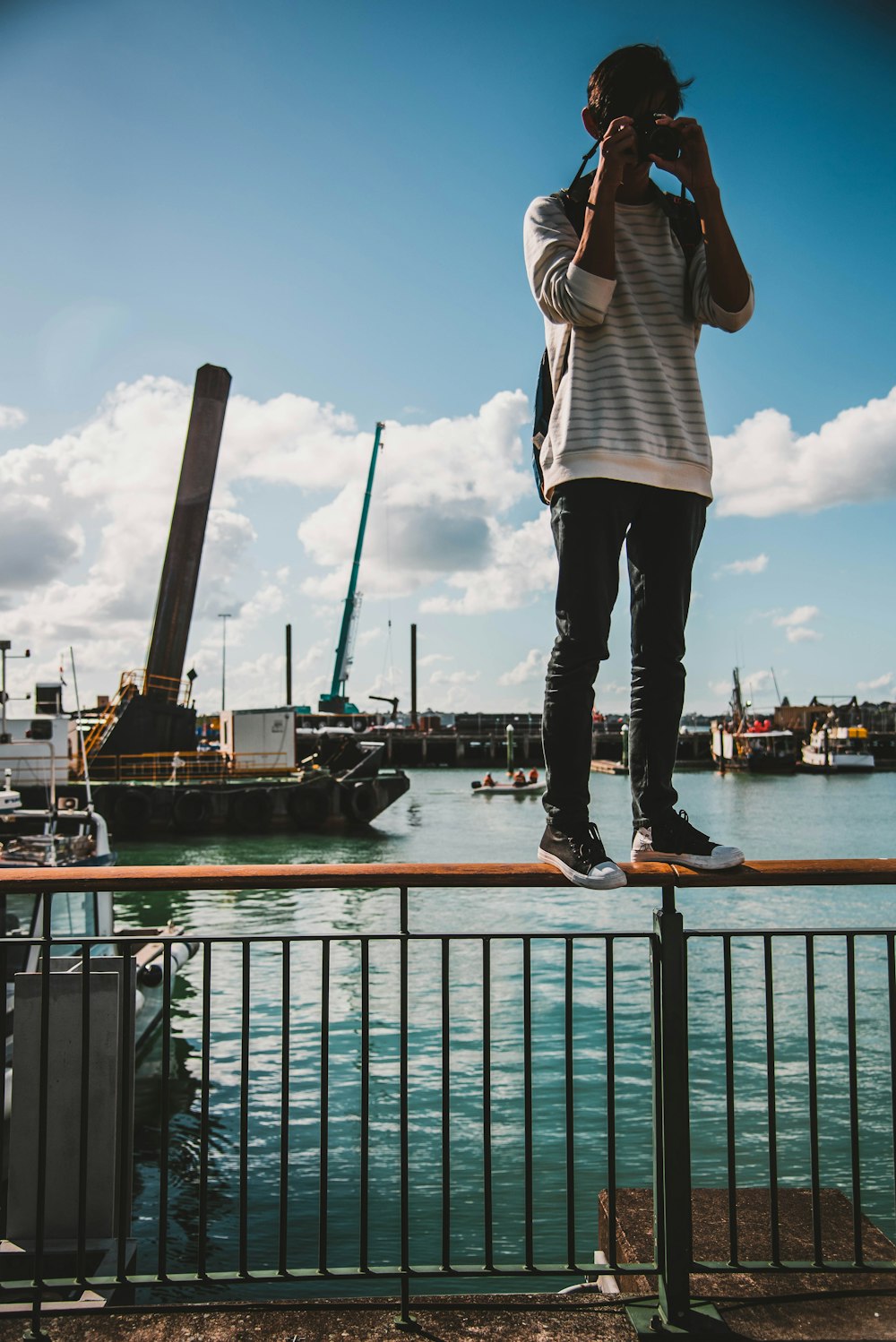 person standing railing during daytime