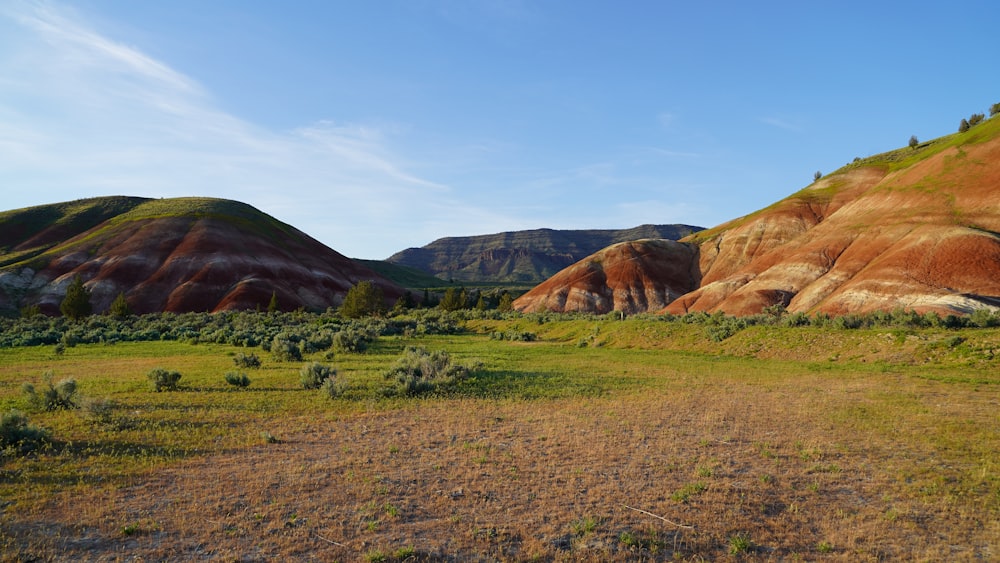 green and brown mountain under blue sky