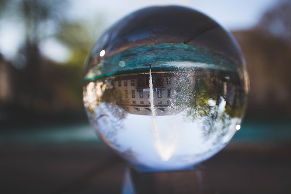 selective focus photography clear glass ball