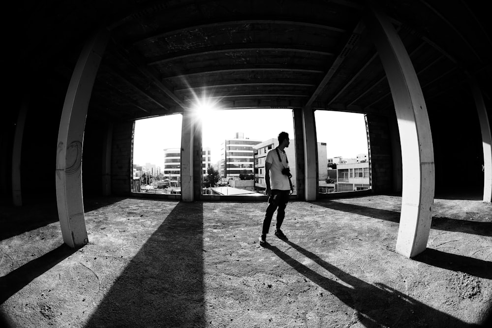 man standing near post