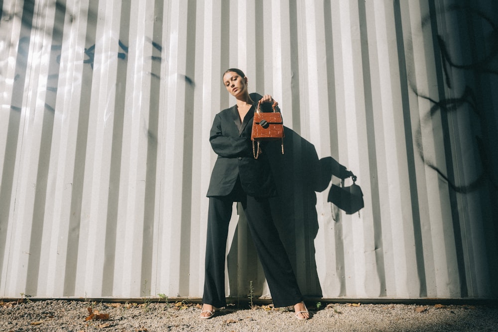 woman holding red handbag