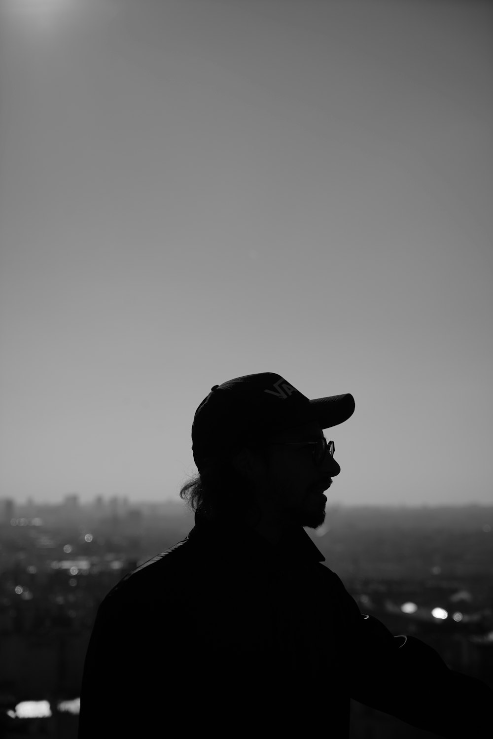 man in eyeglasses wearing cap