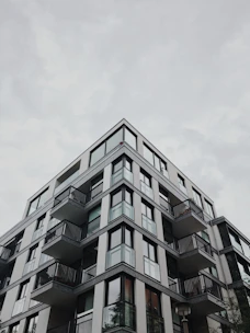 A modern apartment building with clean architectural lines and large windows.