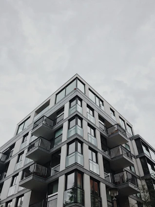 A modern apartment building with clean architectural lines and large windows.