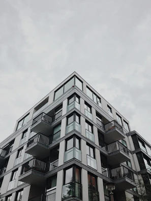 Modern residential apartment building with clean lines and large windows.