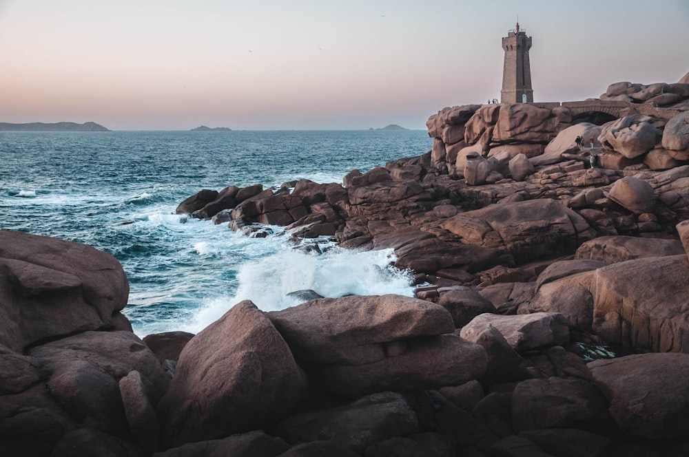 lighthouse on pile of rocks