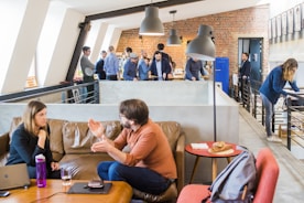 IT consultant discussing strategy with clients in a modern office setting