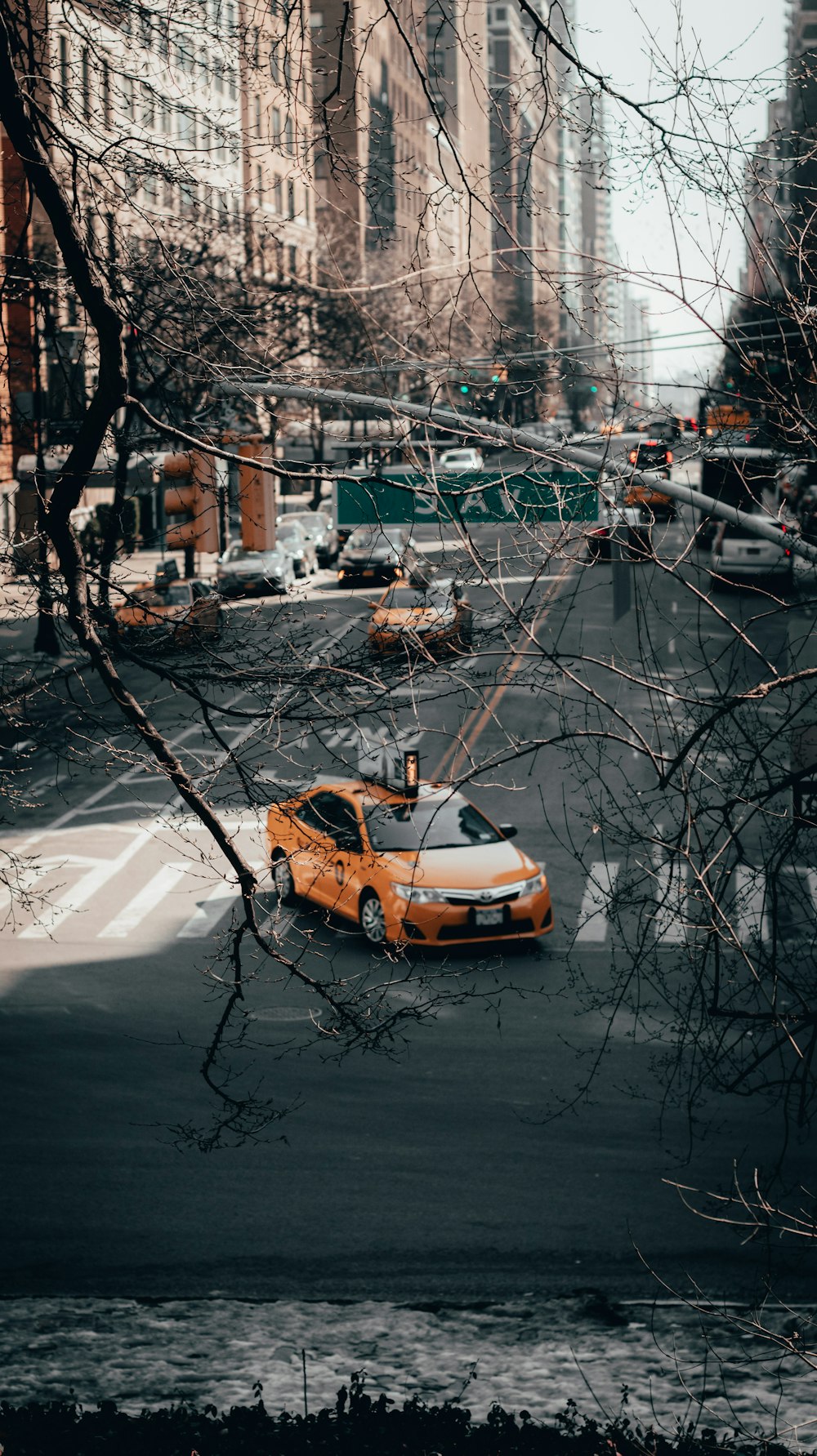 orange sedan on road