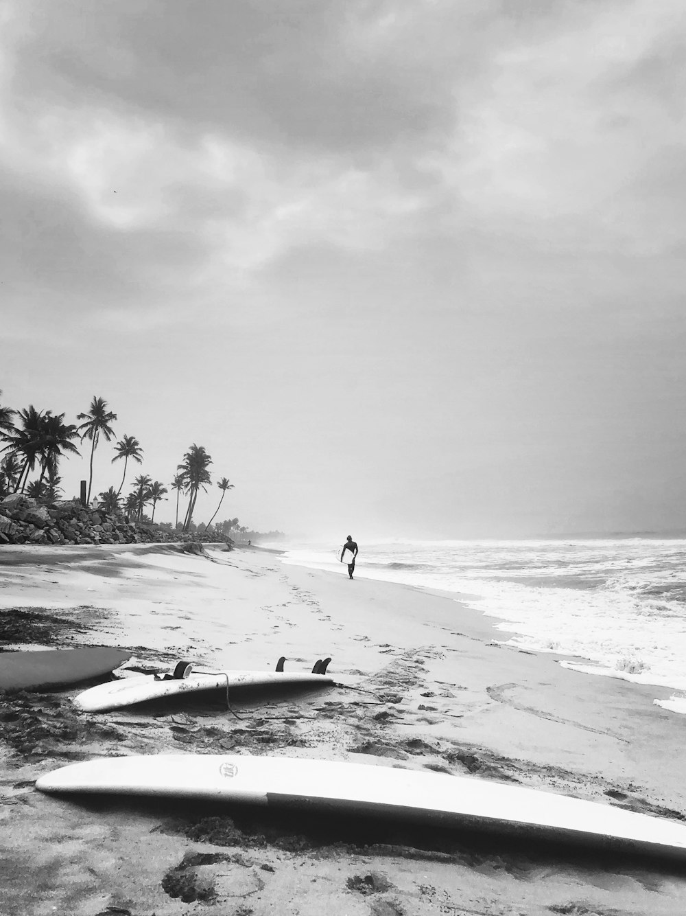 two surfboards on shore