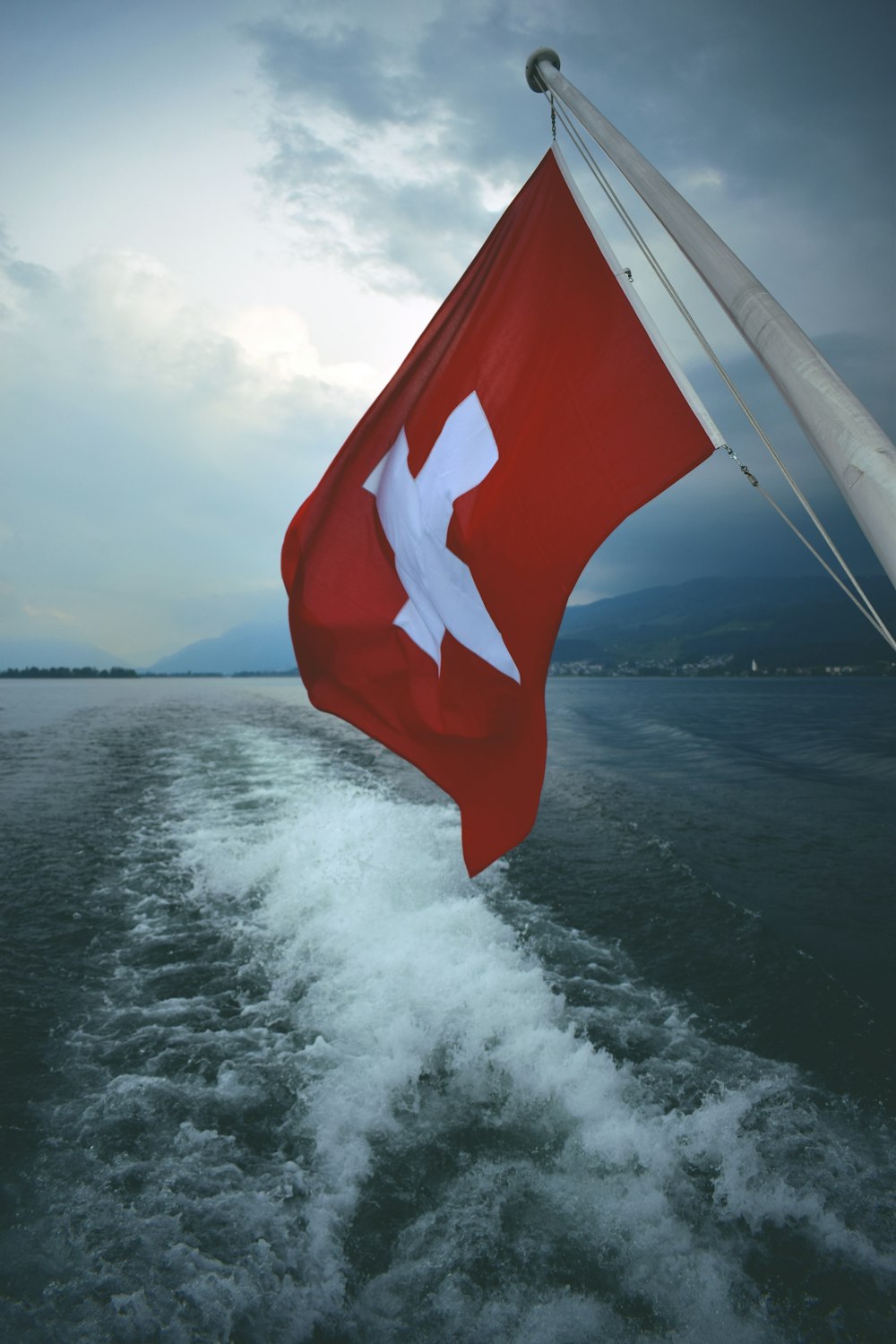 red and white flag on boat