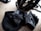 A close-up of a helmet, lock, and bag arranged neatly on an e-bike.