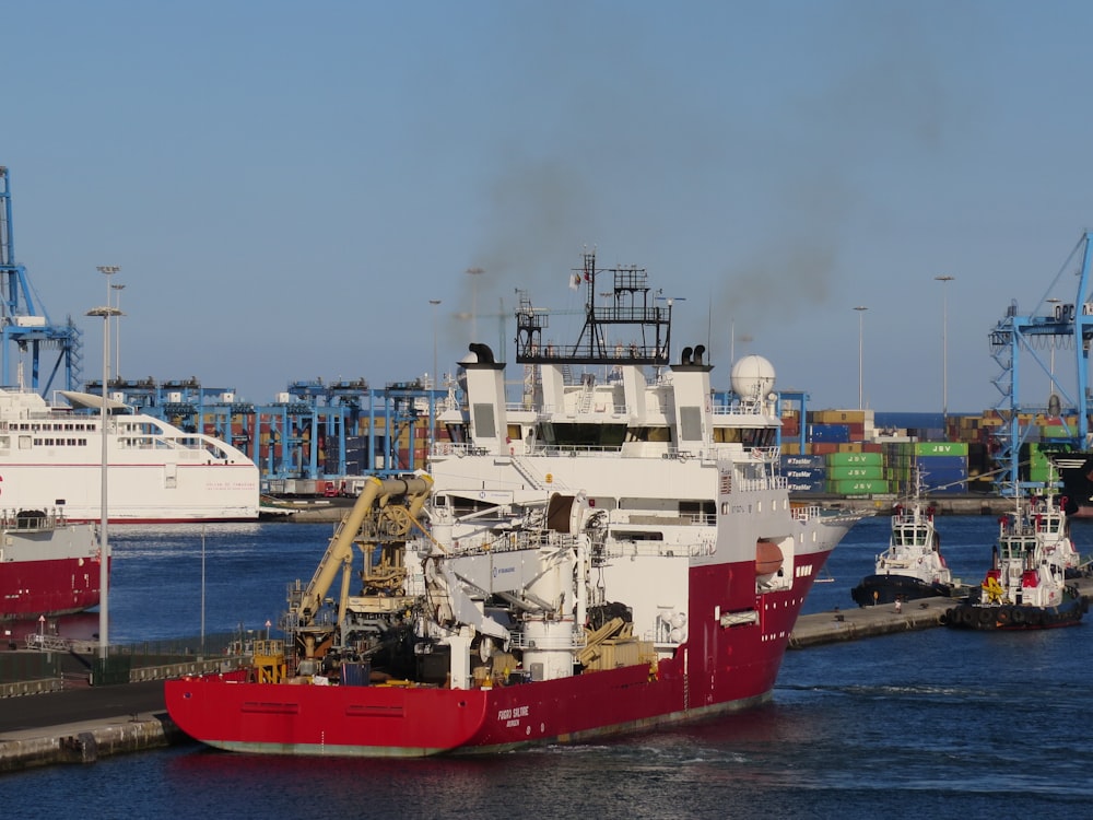 ships and boat on harbour during daytime