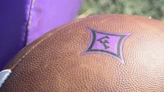 Close-up of a premium football jersey showing embroidered club badge and fabric texture.