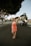 woman standing on road during daytime