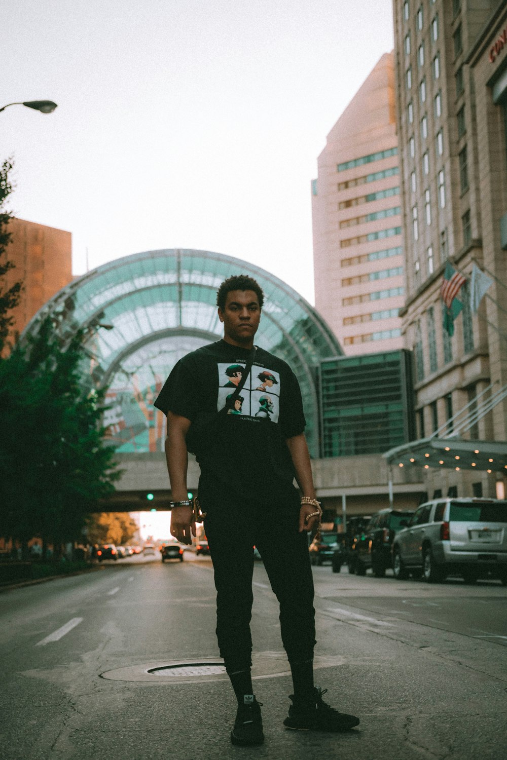 man standing on road during daytime