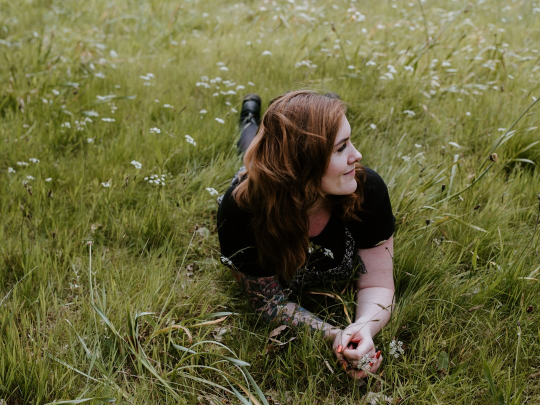 woman lying on grasses