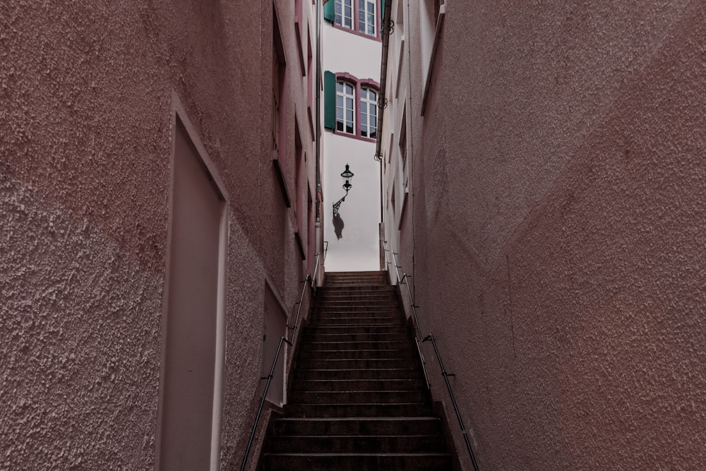 empty stair between concrete buildings