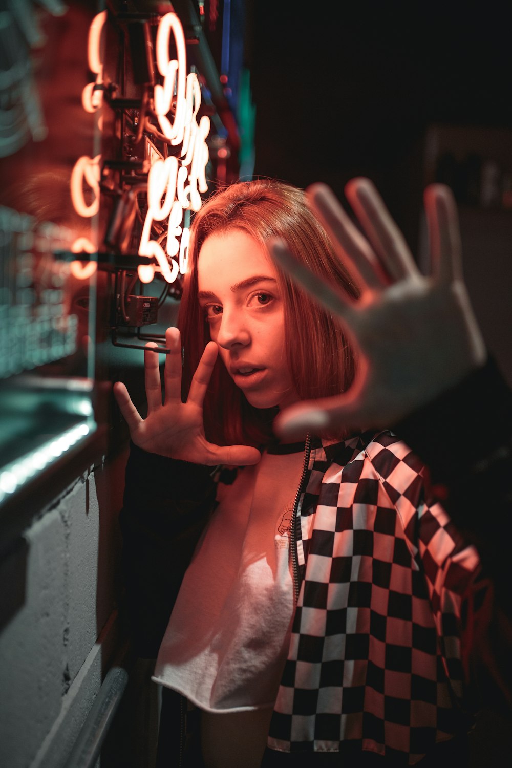 woman wearing white and black checkered jacket