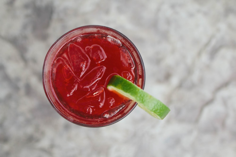 clear drinking glass with red juice