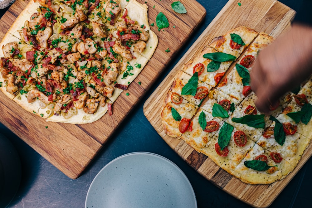 two leafy vegetable pizzas