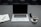 A serene workspace with a laptop, coffee, and a notepad, suggesting productivity.