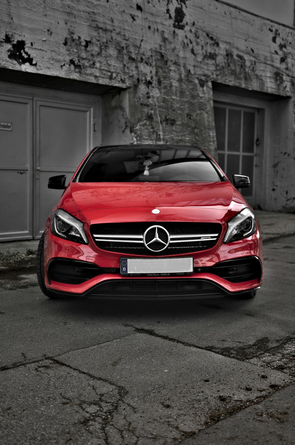red Mercedes-Benz car on road