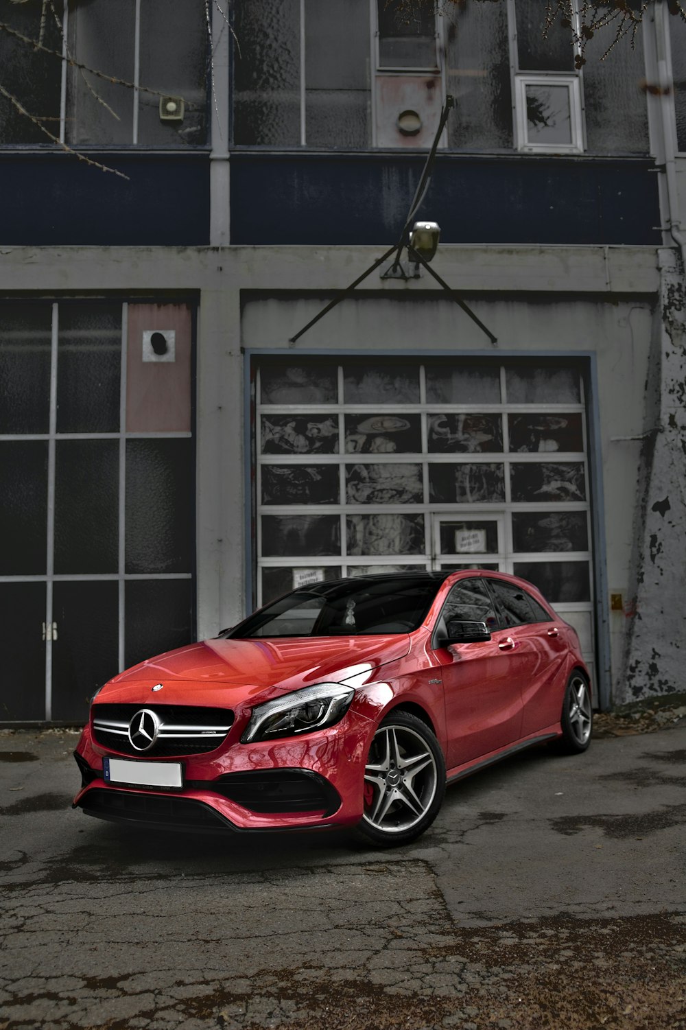 red Mercedes-Benz car on road