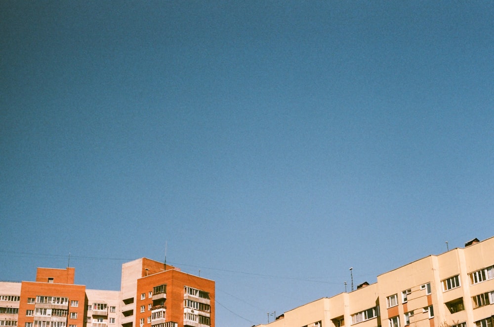 brown concrete buildings under blue sky during daytime