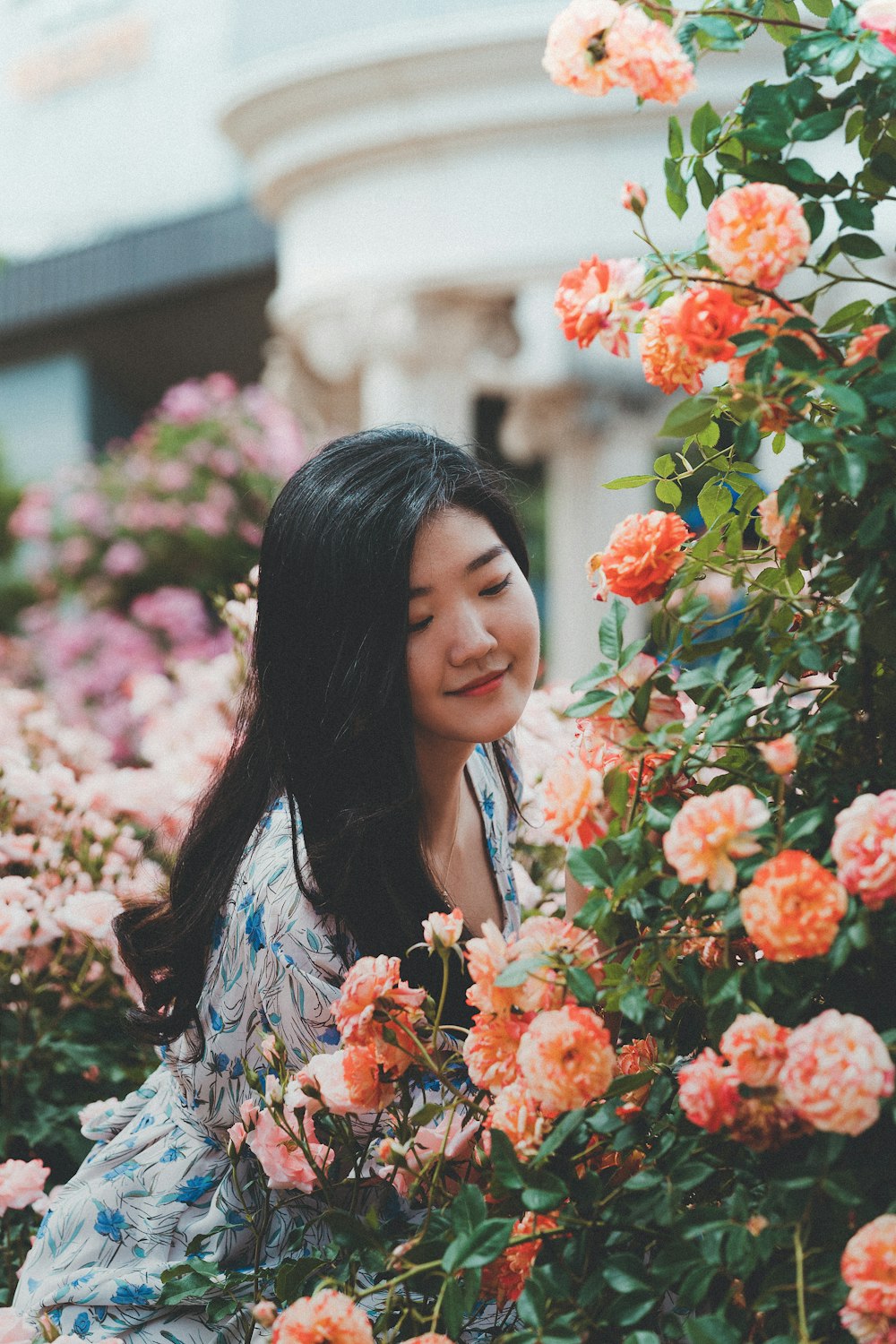 woman near flower plants