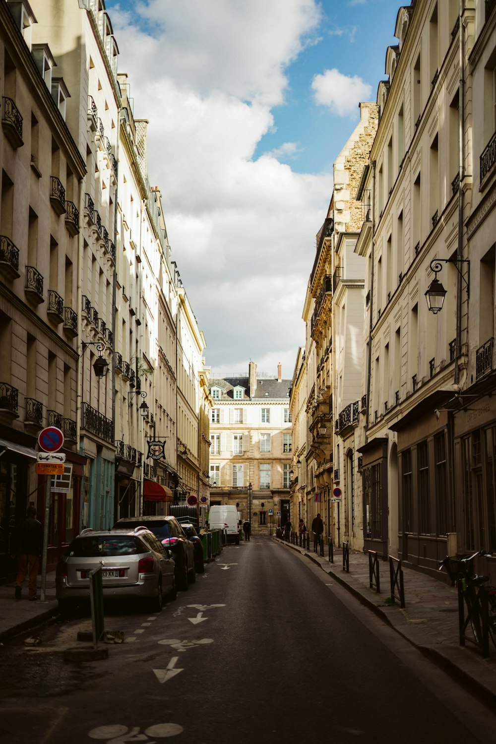 parked vehicles between two buildings