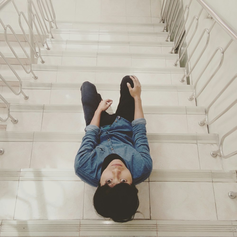 unknown person sitting on stair