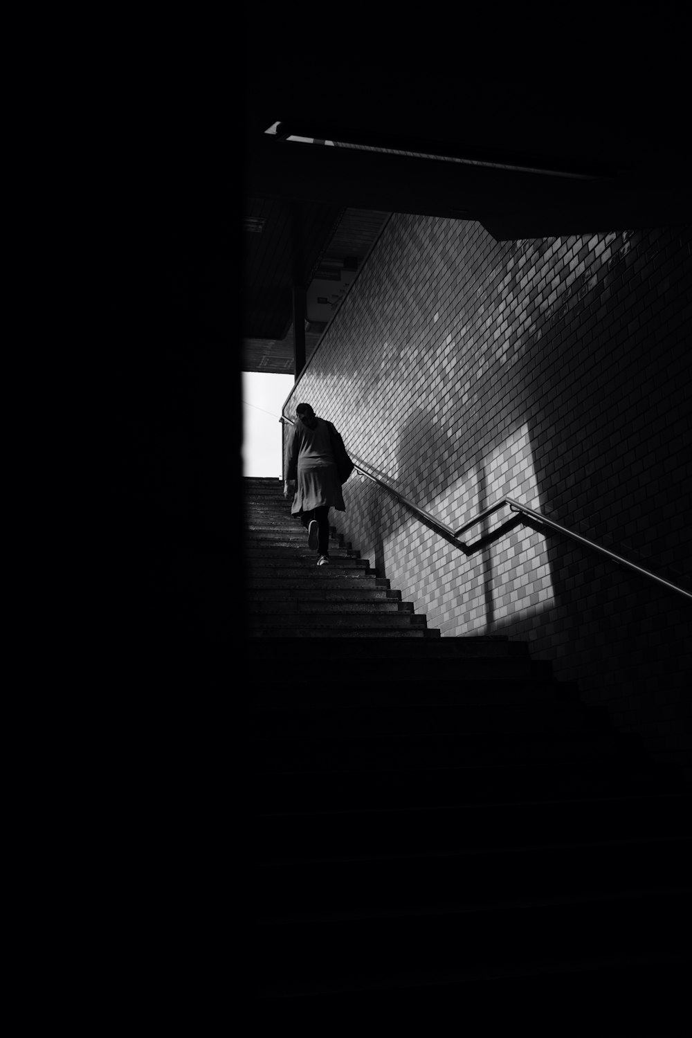 a person walking up a set of stairs