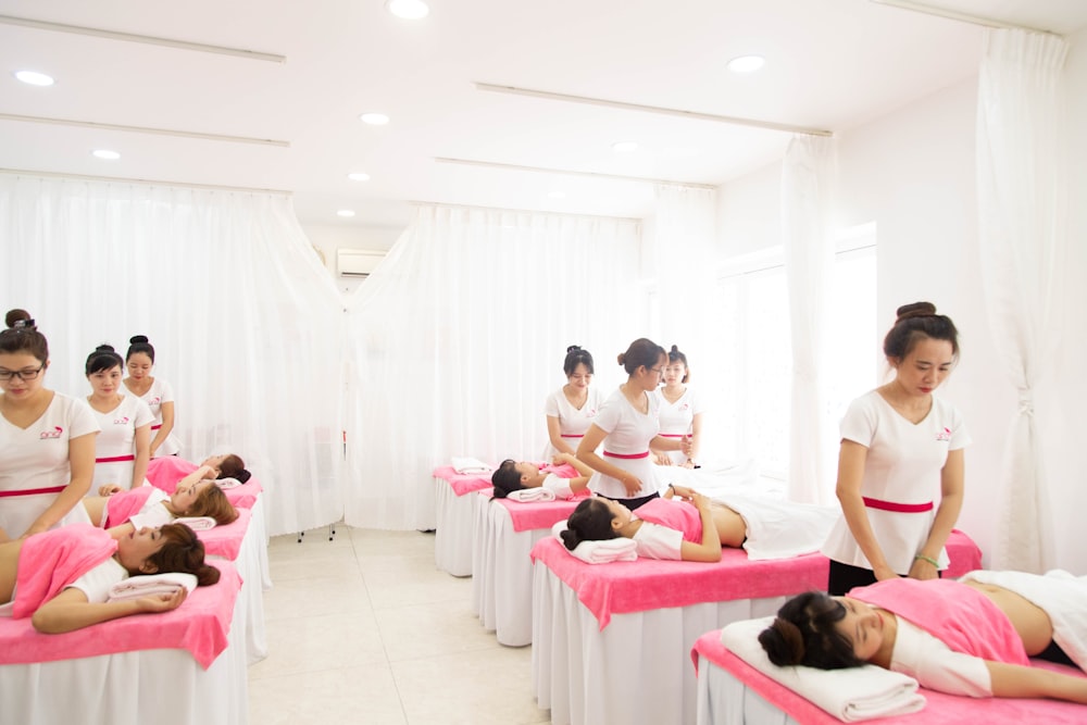 massage room with pink and white theme