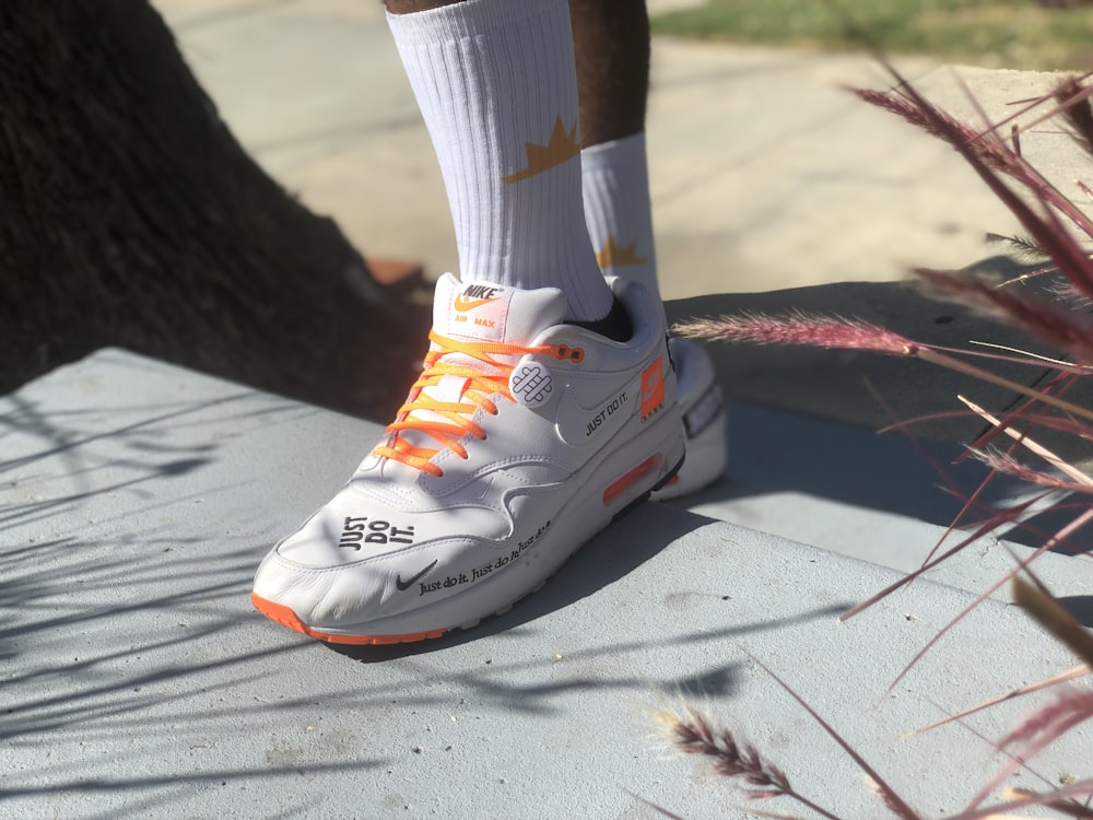 shallow focus photo of white Nike Air Max 90's